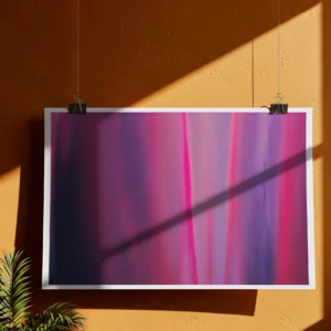 An unframed abstract poster print hangs from clips on an orange wall. A large diagonal shadow from sunlight is cast across the artwork
