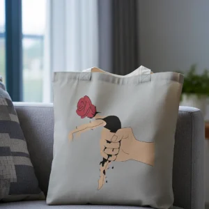A tote bag mockup sits on a grey couch in a softly lit room. Natural light filters through a window, creating a calm and minimalist atmosphere.